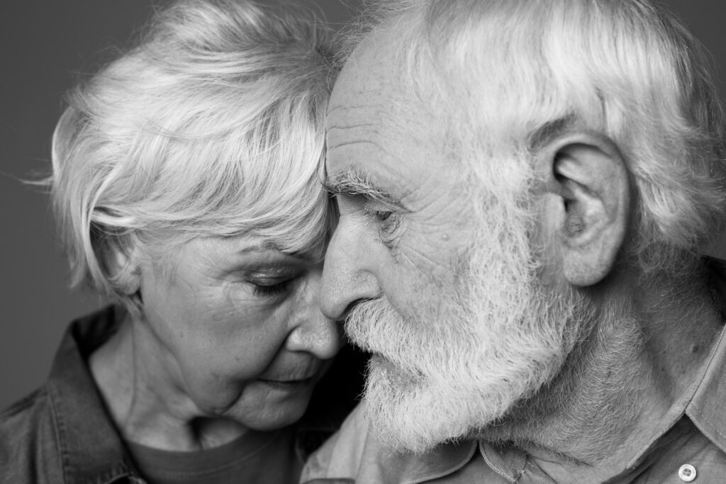 Close,Up,Black-and-white,Portrait,Of,Grey-haired,Man,And,Woman,Standing