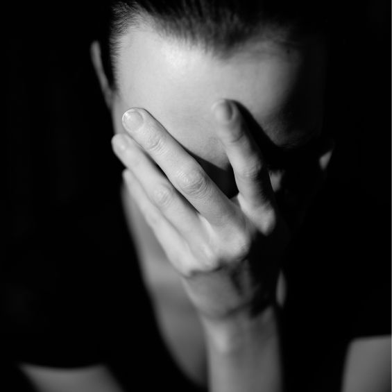 woman with hand over face