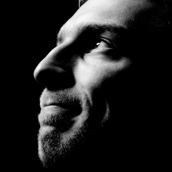 man looking up towards light
